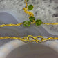 14 karaat gouden ketting met groene steentjes