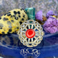 Zilveren ring met rood steentje
