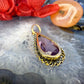 14 karaat gouden hanger met paarse steen