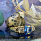 18 karaat gouden ring met topaas en spinel