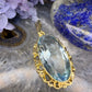 14 karaat gouden hanger met blauwe steen