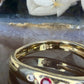 14 karaat gouden ring met edelstenen en diamant