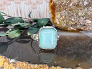 Zilveren ring met melkglas