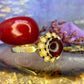 18 karaat gouden ring met granaat en parels