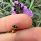 14 karaat gouden piercing met groene granaat